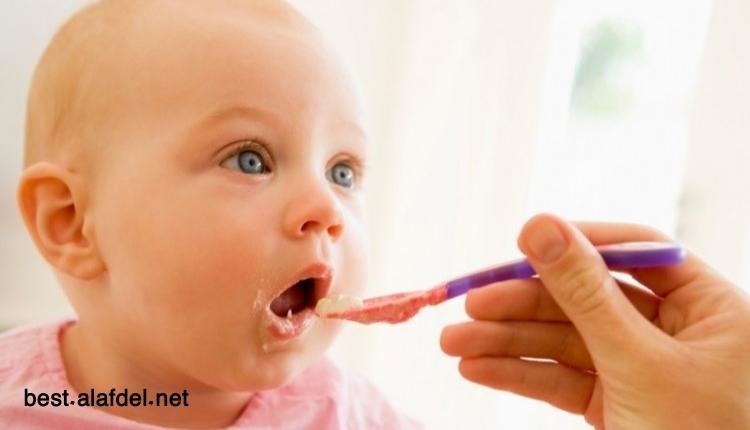 A picture of a baby being fed with a spoon when talking about Gluten and Allergenic Foods in Your Toddler's Diet
